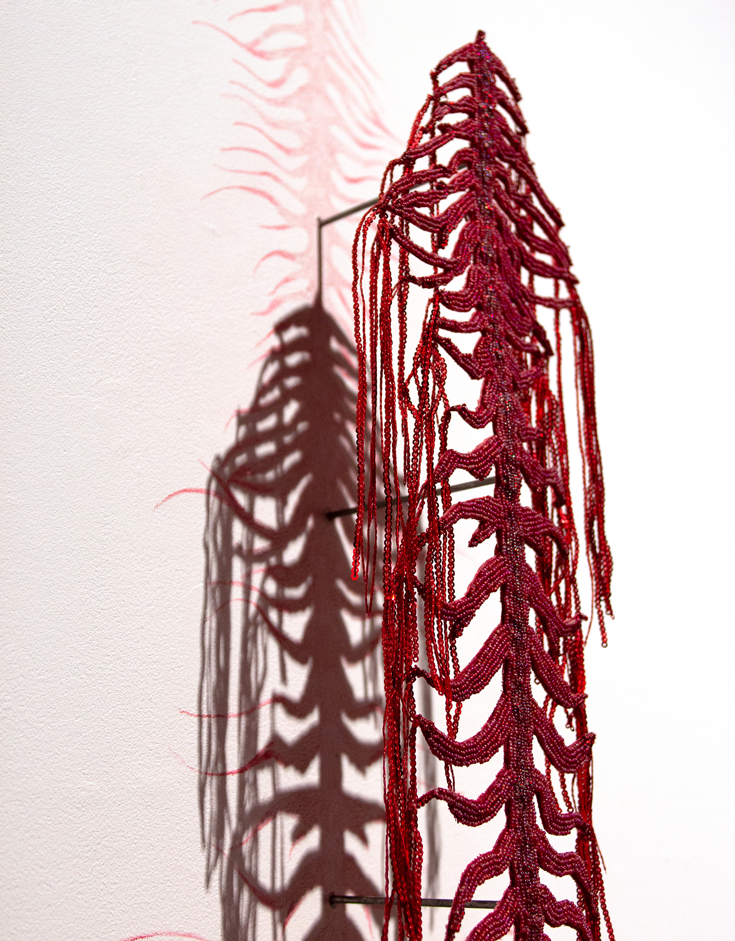 Lux Gow Habrich, Blood Song (Fossil), 2025. Seed beads, sequins, earth magnets, steel rods,
watercolour colouring pencils, cotton, thread. Photo by the artist. https://www.luxgowhabrich.com 